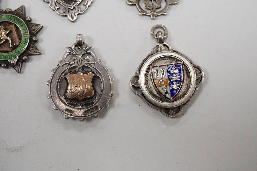 Five assorted early 20th century silver medals, including enamelled 'Luton District Football League, 1910/11', diameter 28mm.